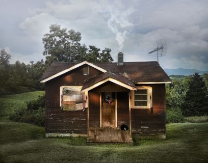 Dilapidated shack in rural field