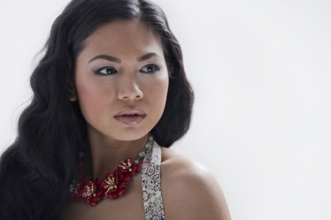 Asian woman wearing flower necklace
