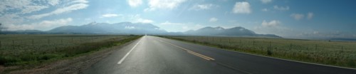 Panoramic view of empty road in rural landscape