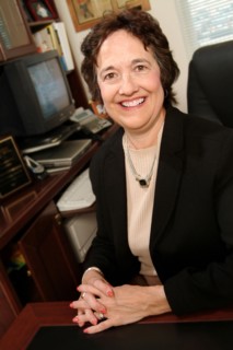 Businesswoman smiling at desk