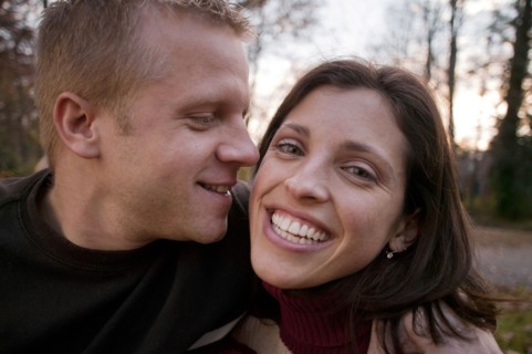 Smiling couple hugging outdoors