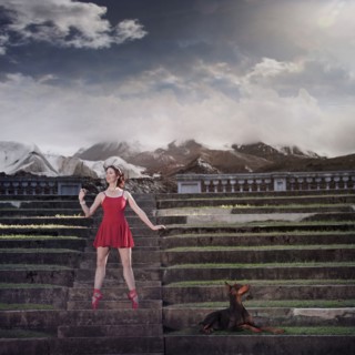 Caucasian ballet dancer balancing on ruins