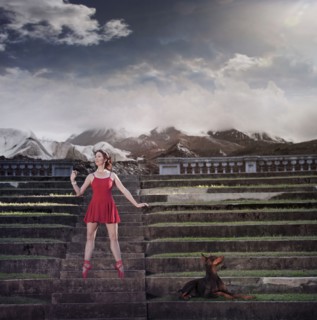 Caucasian ballet dancer balancing on ruins
