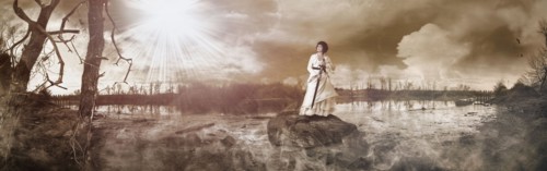 Caucasian woman standing on rock in remote lake