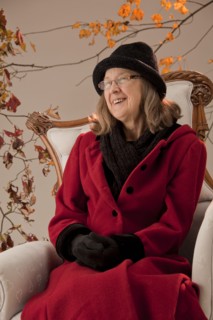 Caucasian woman sitting in armchair outdoors