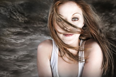 Hair of Caucasian woman blowing in storm wind