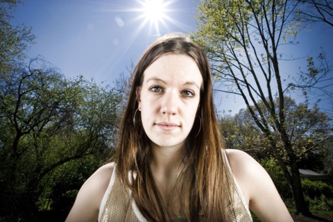 Serious Caucasian woman in forest