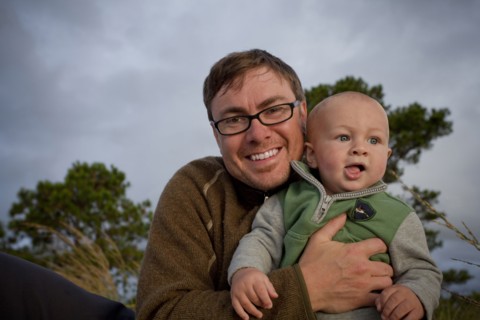 Portrait of smiling Caucasian father holding baby son