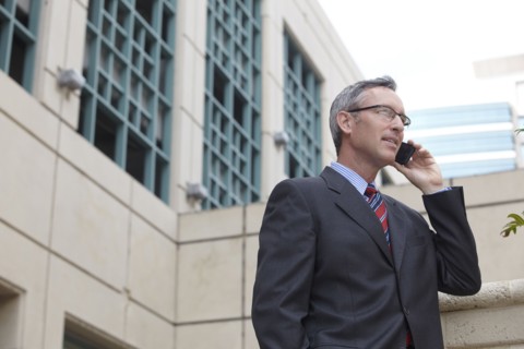 Caucasian businessman talking on cell phone