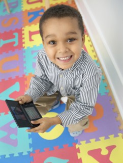 Mixed race boy playing video game