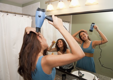 Hispanic women preparing for girl's night out