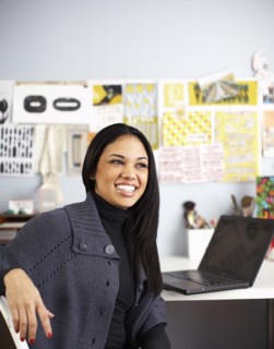 Smiling businesswoman sitting at desk