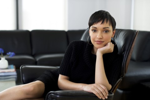 Serious businesswoman sitting in chair