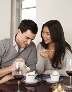 Couple eating dessert together