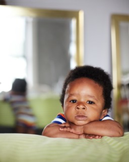African American baby with arms crossed