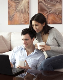 Couple looking at laptop together