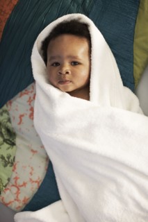 African American baby wrapped in towel