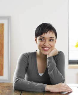 Smiling woman with hand on chin