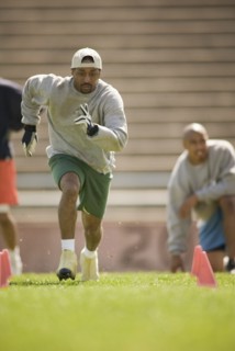 Men training on football field