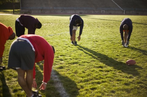 Men training on football field