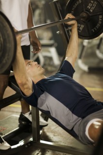 Man lifting weights in health club