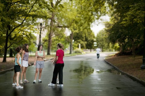 Runners talking in park