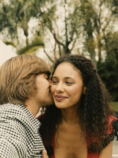 Couple kissing outdoors