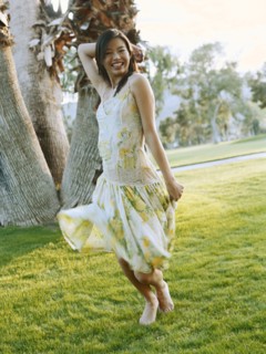 Happy woman dancing in field