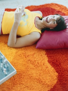 Woman laying on pillow on floor