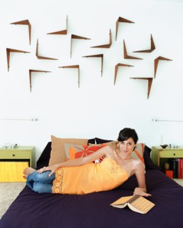 Woman reading book in bed