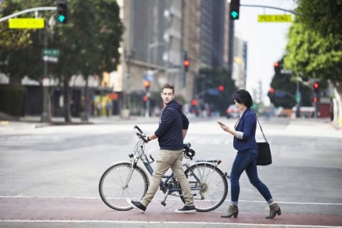 Caucasian business people crossing city street