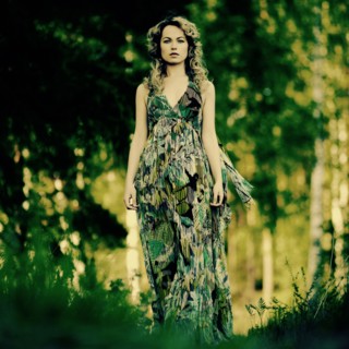 Caucasian woman walking in grass