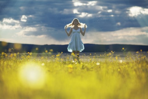 Caucasian woman walking in rural field