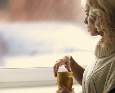 Caucasian woman looking out window