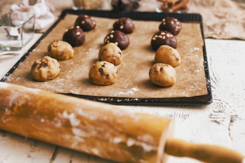 Cookie dough on baking sheet near rolling pin