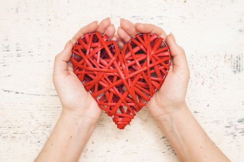 Hands of woman holding handmade valentine
