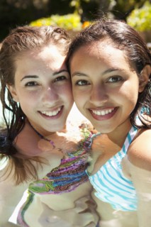 Girls enjoying swimming pool together