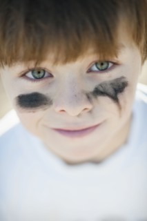 Caucasian baseball player with marks on cheeks