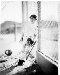 Caucasian baseball player standing on field
