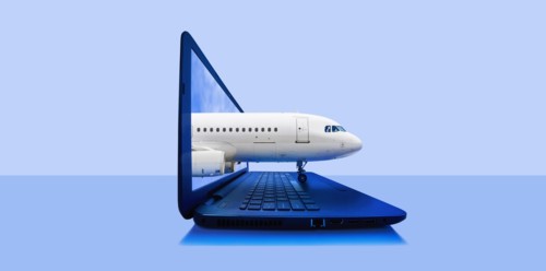 Airplane emerging from laptop screen
