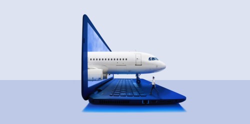 Airplane emerging from laptop screen with pilot walking on keyboard