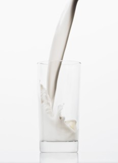 Milk pouring into glass