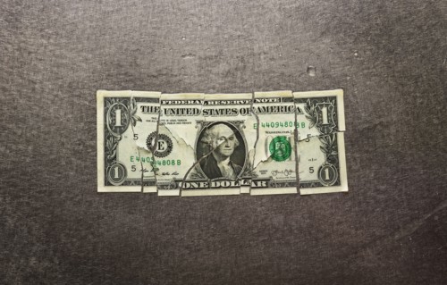 Broken dollar bill