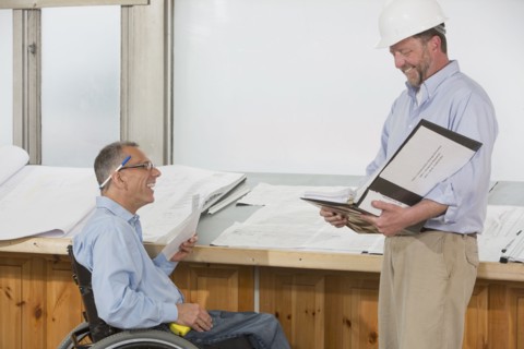 Caucasian architects talking in office