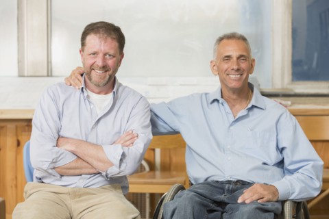 Caucasian businessmen smiling in office