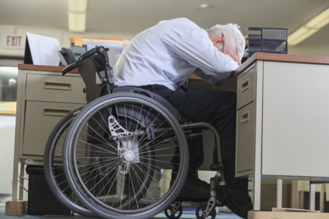 Caucasian businessman resting on office desk