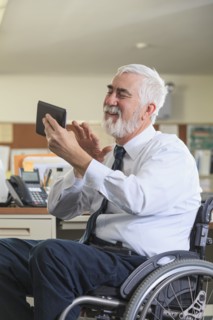 Caucasian businessman using digital tablet in office