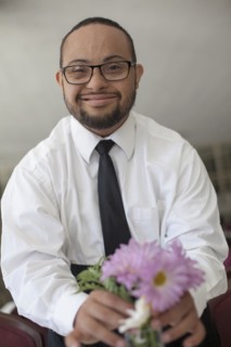 Mixed race man arranging flowers