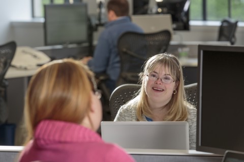 Caucasian businesswomen talking in office