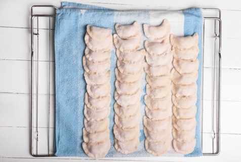 Rows of pierogies on towel